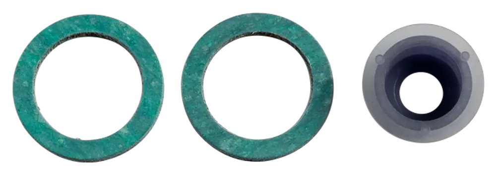 Drei Dichtungsringe in grün und ein Dichtungsstopfen in transparentem Material, hergestellt von Wolf. Die Ringe haben einen äußeren und inneren Durchmesser.